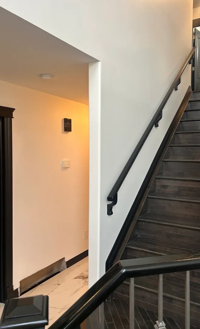 Refinished stair railings and spindles — Leonard’s Painting, Edmonton area