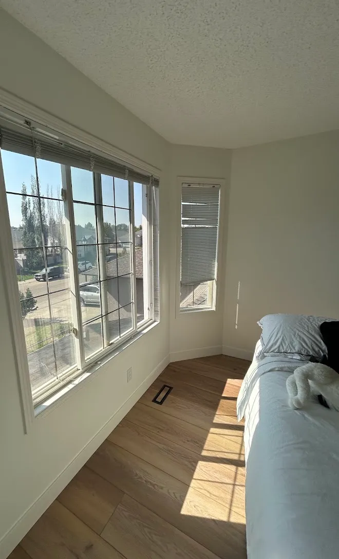 Repainted living space with clean lines and even coverage — Leonard’s Painting, Edmonton area
