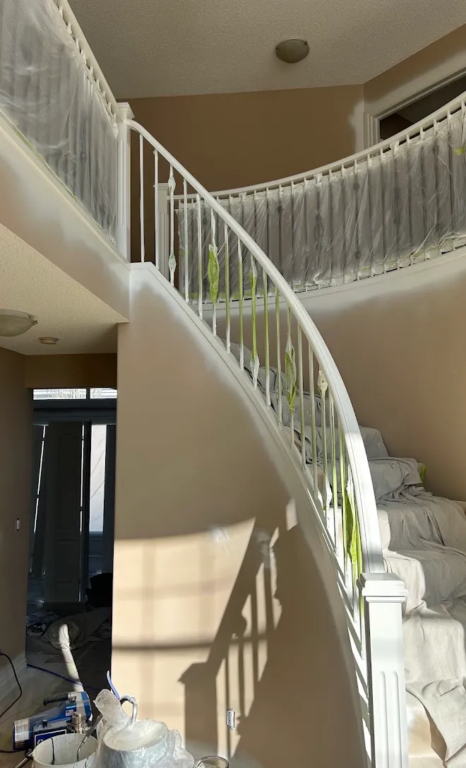 Staircase spindles and railings with a fresh painted finish — Leonard’s Painting, Edmonton area