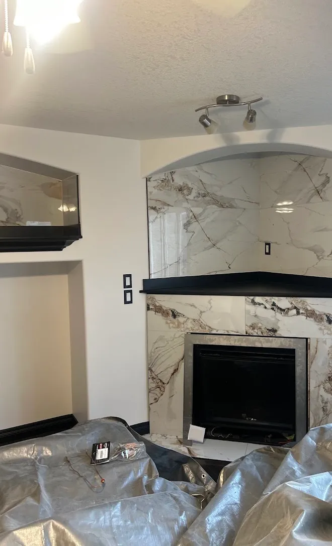Interior finish work with a painted feature wall — Leonard’s Painting, Edmonton area