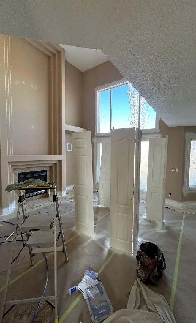 Freshly painted interior walls and ceilings, masked and prepped mid-project — Leonard’s Painting, Edmonton area