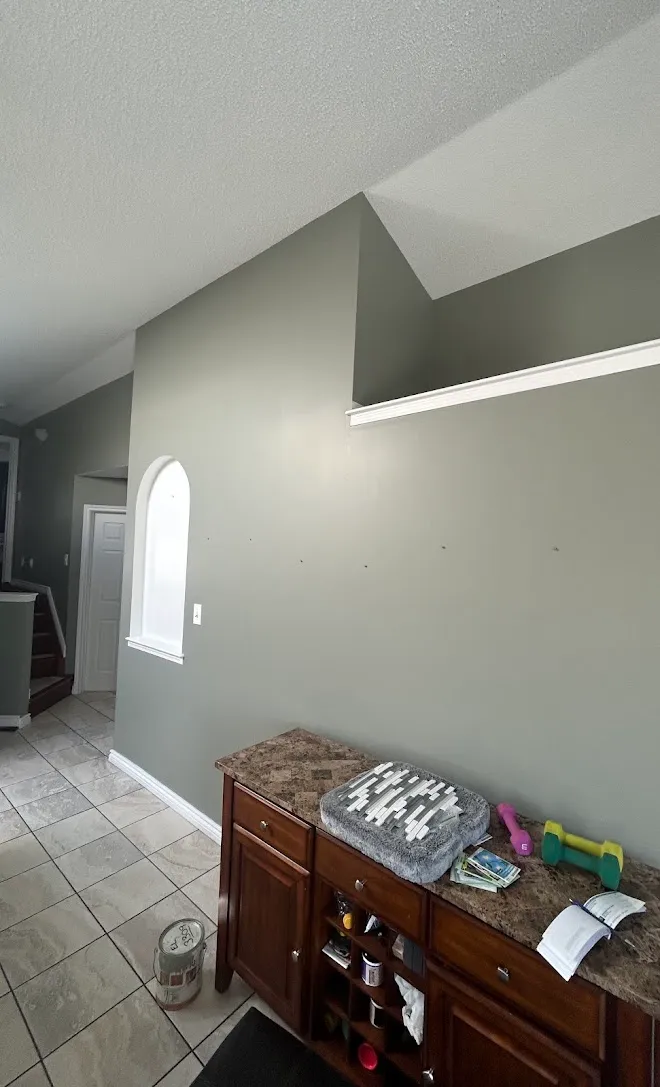Interior finish work with a painted feature wall — Leonard’s Painting, Edmonton area