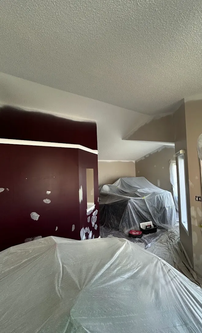Repainted living space, masked and prepped mid-project — Leonard’s Painting, Edmonton area