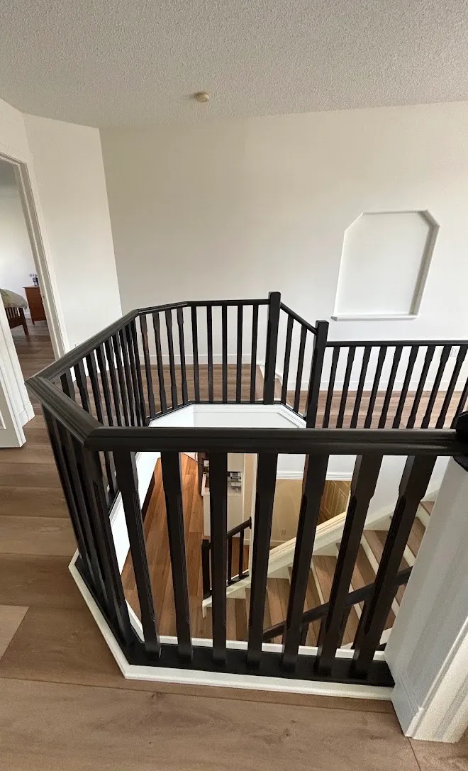 Refinished stair railings and spindles — Leonard’s Painting, Edmonton area