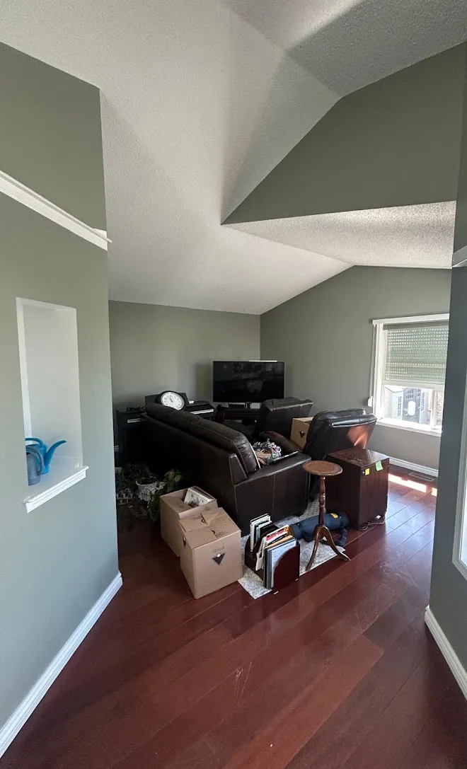 Repainted living space with clean lines and even coverage — Leonard’s Painting, Edmonton area