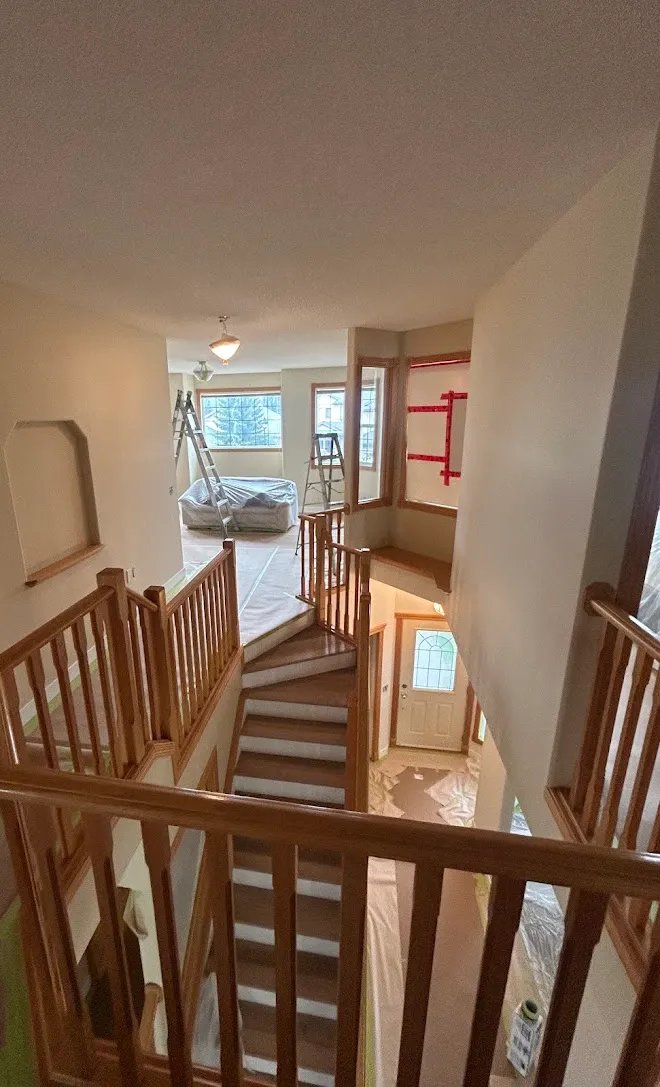 Staircase spindles and railings with a fresh painted finish — Leonard’s Painting, Edmonton area