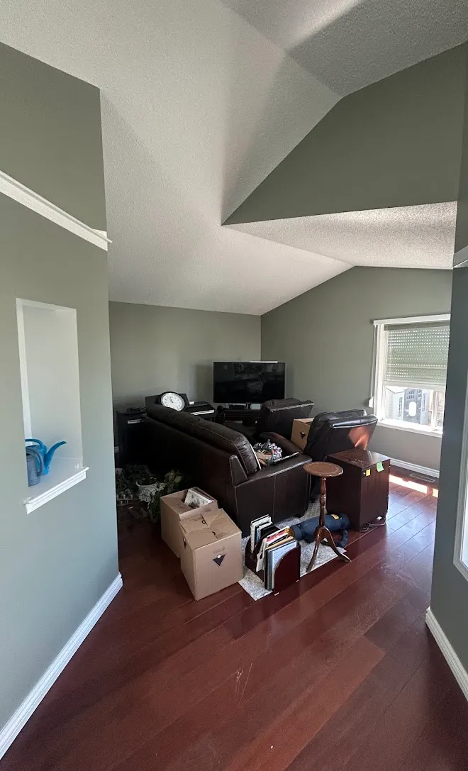 Repainted living space with clean lines and even coverage — Leonard’s Painting, Edmonton area