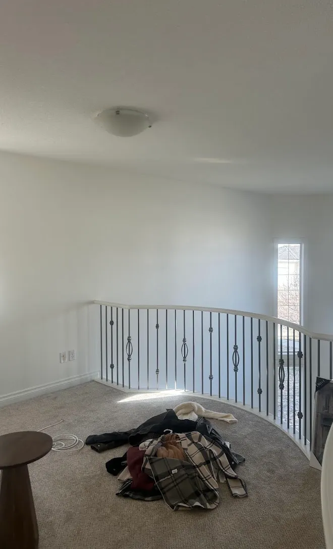 Refinished stair railings and spindles — Leonard’s Painting, Edmonton area
