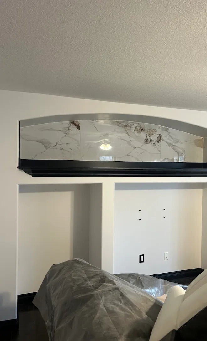 Interior finish work with a painted feature wall — Leonard’s Painting, Edmonton area