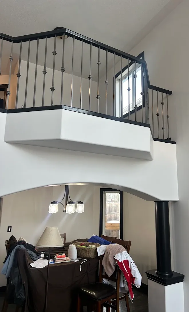 Staircase spindles and railings with a fresh painted finish — Leonard’s Painting, Edmonton area