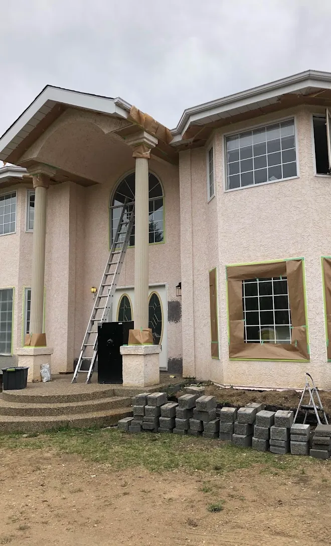Columned estate exterior prepped for repainting — Leonard’s Painting, Edmonton area