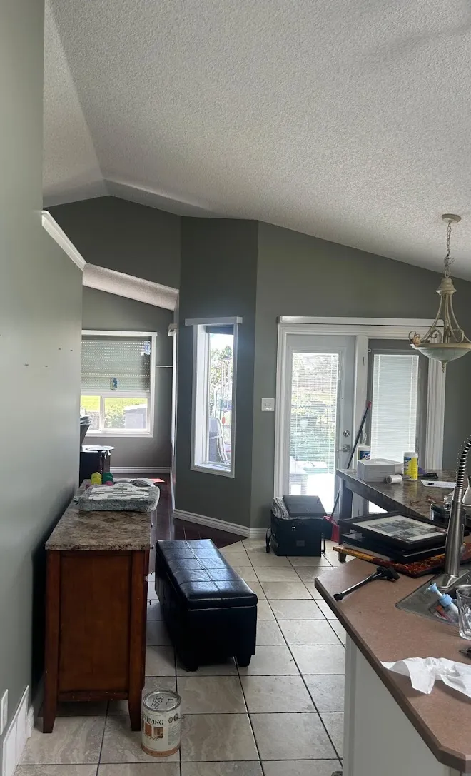 Interior finish work with a painted feature wall — Leonard’s Painting, Edmonton area
