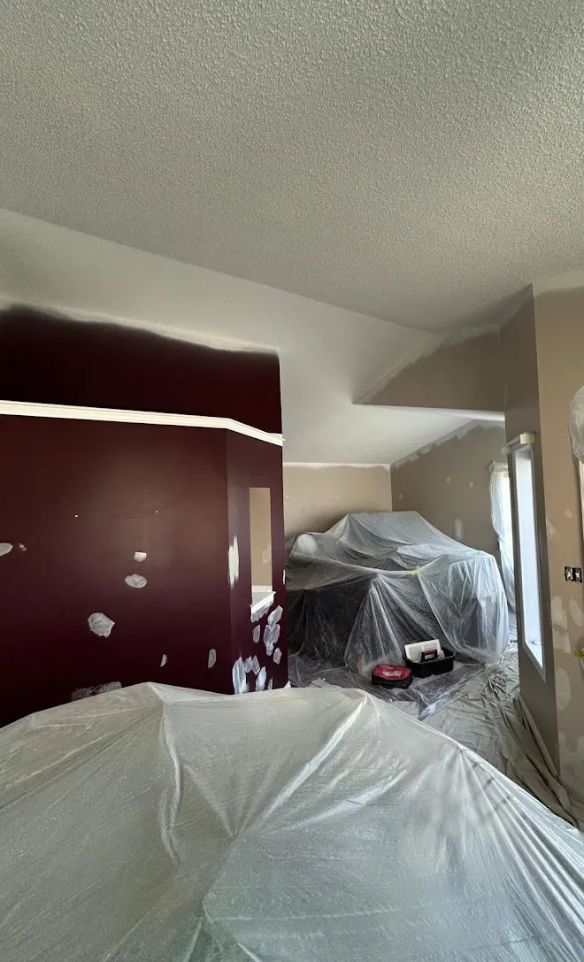 Repainted living space, masked and prepped mid-project — Leonard’s Painting, Edmonton area