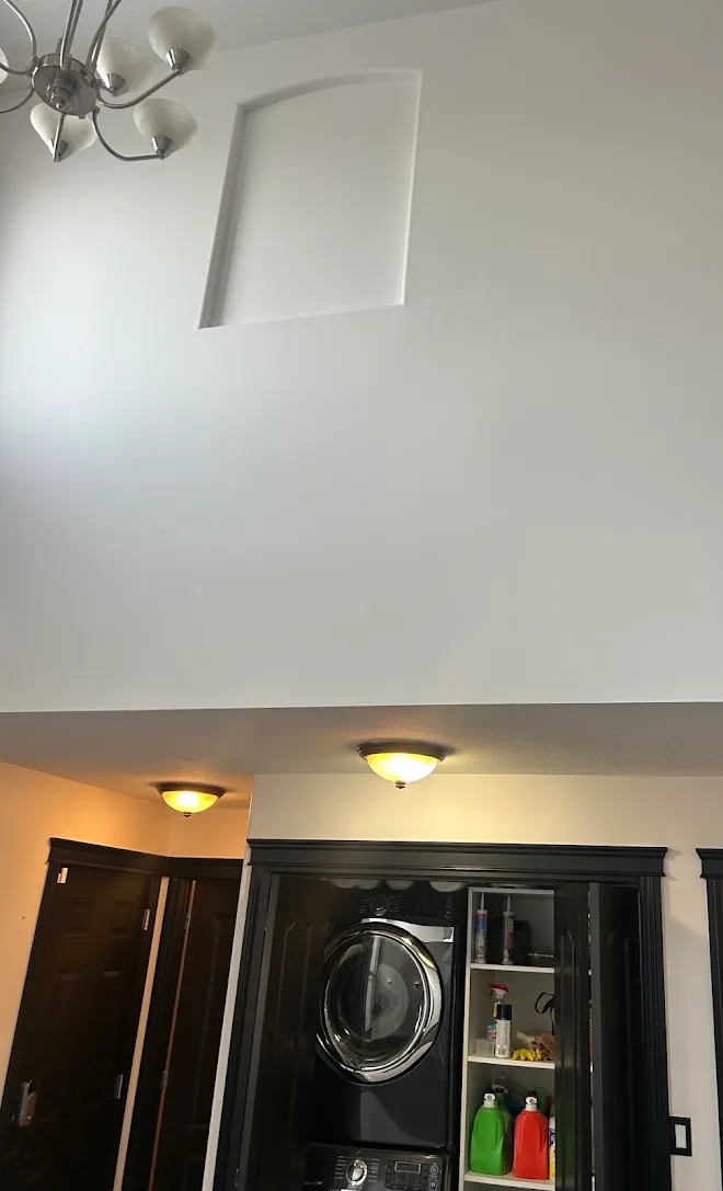 Interior finish work with a painted feature wall — Leonard’s Painting, Edmonton area