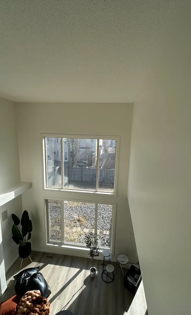 Repainted living space with clean lines and even coverage — Leonard’s Painting, Edmonton area